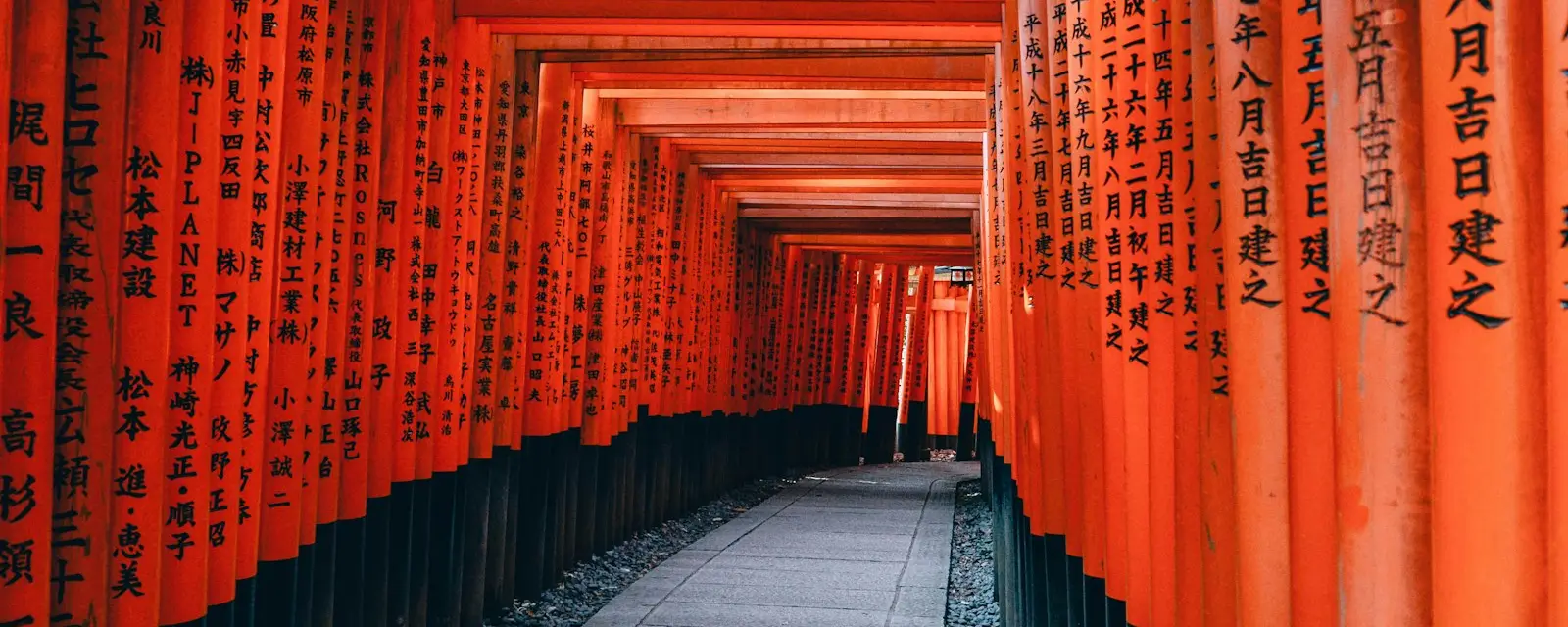 Tunnel of vermilion torii gates at Fushimi Inari Shrine, Kyoto