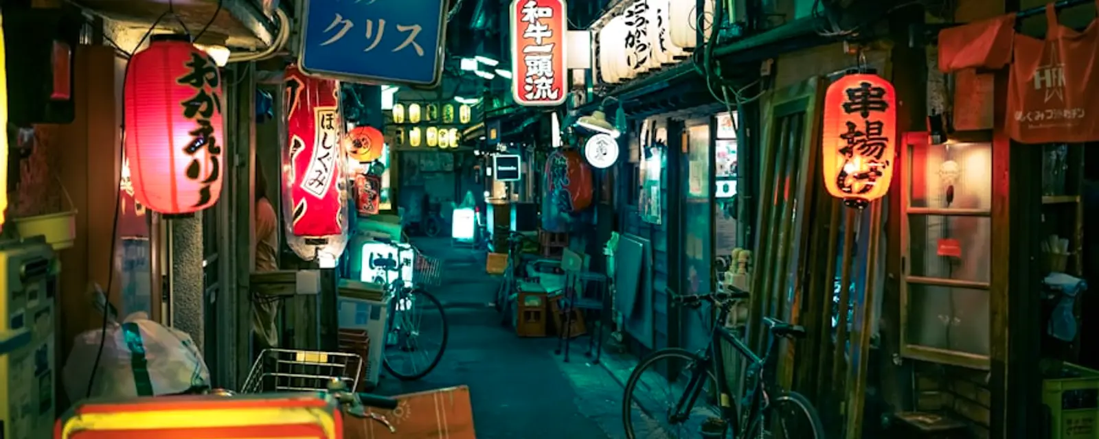 Izakaya alley with red lanterns at night in Tokyo